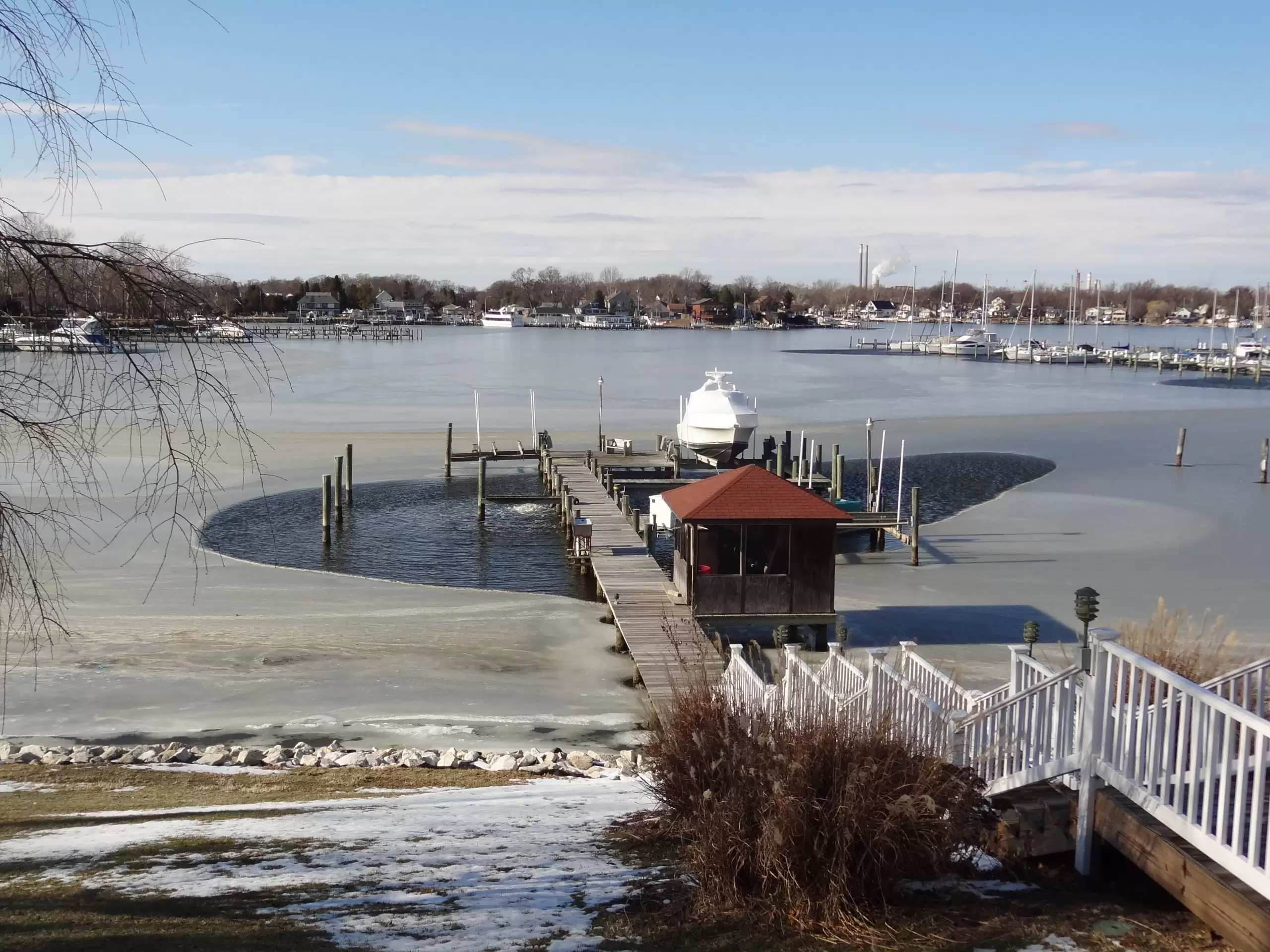 Wooden pier being protected from the lakes ice with an ice breaker